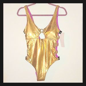 BEBE GOLD ONE PIECE BATHING SUIT WITH SIDE GOLD RINGS DETAILS